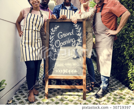 Diverse People with Grand Opening Sign First Day of Business 30719397