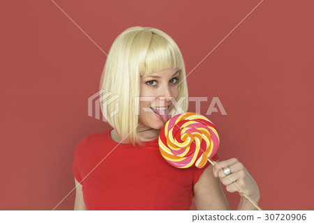 Caucasian Blonde Woman Tasting Lollipop 30720906
