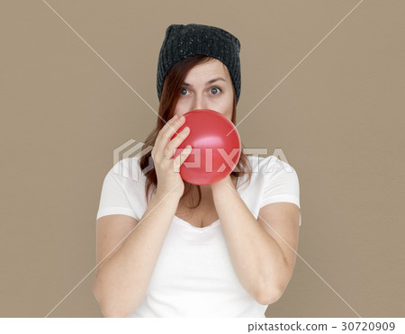Woman Blowing Balloon Playful Studio Portrait Woman Blowing Balloon Playful Studio Portrait 30720909