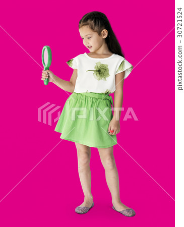 A girl is holding green magnifier A girl is holding green magnifier 30721524