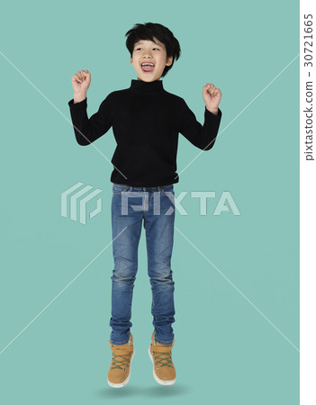 A happiness boy is jumping A happiness boy is jumping 30721665