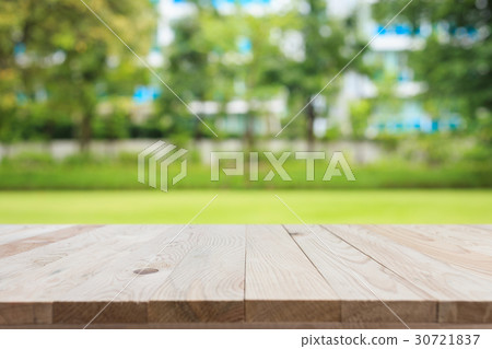 Empty top wooden table and sunny abstract blurred bokeh background Empty top wooden table and sunny abstract blurred bokeh background 30721837