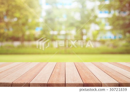 Empty top wooden table and sunny abstract blurred bokeh background Empty top wooden table and sunny abstract blurred bokeh background 30721839