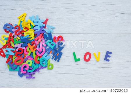 Colorful wooden alphabet and LOVE word. Top view on white wooden Colorful wooden alphabet and LOVE word. Top view on white wooden 30722013
