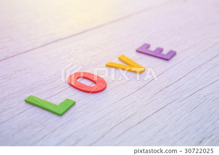 Colorful wooden alphabet and LOVE word. Top view on white wooden Colorful wooden alphabet and LOVE word. Top view on white wooden 30722025