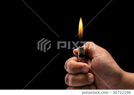 Hand holding burning gas lighter. Studio shot isolated on black background 30722196