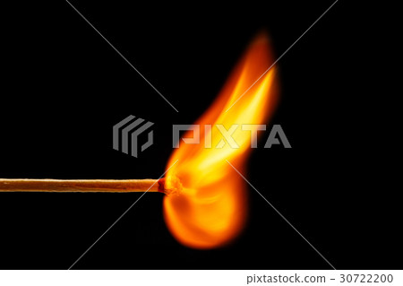 Macro fire burning on matchstick. Studio shot isolated on black Macro fire burning on matchstick. Studio shot isolated on black 30722200