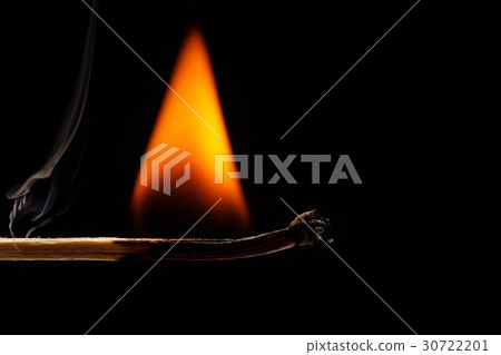 Macro fire burning on matchstick. Studio shot isolated on black Macro fire burning on matchstick. Studio shot isolated on black 30722201