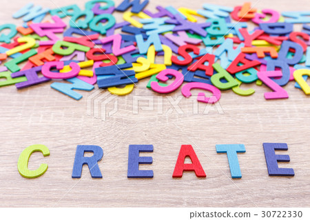 Colorful wooden alphabet and word "CREATE". Top view on grey wooden table Colorful wooden alphabet and word "CREATE". Top view on grey wooden table 30722330