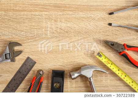 New of assorted work tools on wood with copy space for text New of assorted work tools on wood with copy space for text 30722389