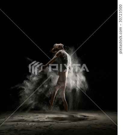 Sexy girl in a cloud of white dust studio portrait 30723500