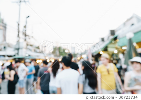 Blurred people shopping on weekend market street 30723734