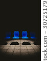 Public chair in the dark. 30725179