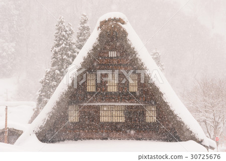 snowy, having a steep thatched rafter roof, house with a steep rafter roof 30725676