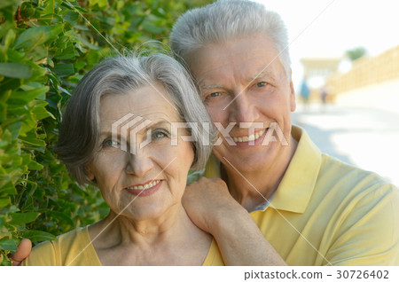 Happy elderly couple embracing 30726402