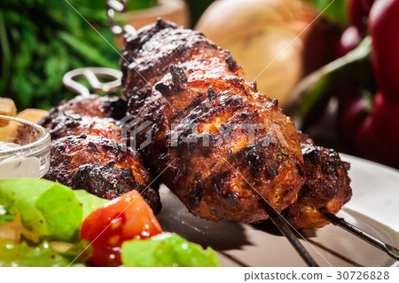 Grilled shish kebab served with fried chips 30726828