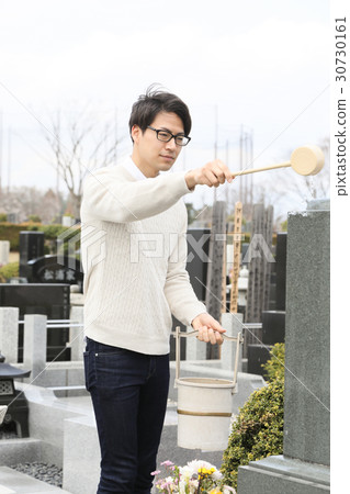 a visit to a grave  30730161