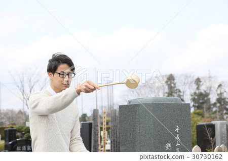 a visit to a grave  30730162