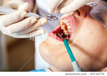 dentistry, patient examination and treatment at 30730778