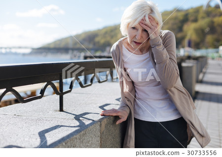 Distressing pensioner having headache in the 30733556