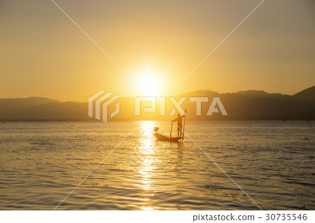 Fisherman of Lake in action when fishing Fisherman of Lake in action when fishing 30735546