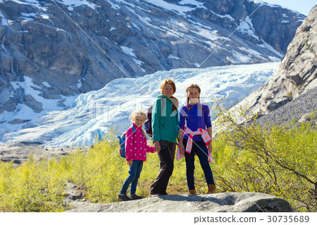 mother and daughters on a Nigardsbreen glacier mother and daughters on a Nigardsbreen glacier 30735689