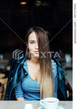 Beautiful girl in a black jacket Beautiful girl in a black jacket 30737845