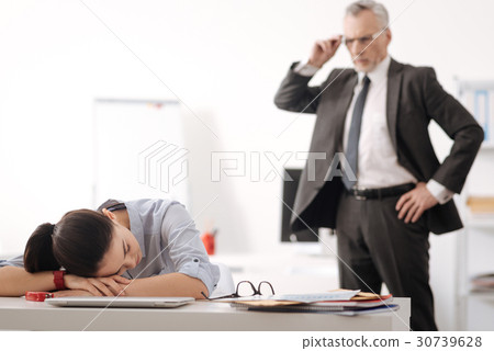 Tired office worker lying her head on hands 30739628