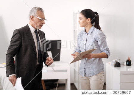 Sad young woman showing folder with result Sad young woman showing folder with result 30739667