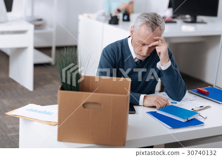 Upset male office worker being deep in thoughts Upset male office worker being deep in thoughts 30740132