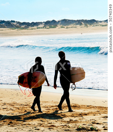 Surfers couple on the beach 30740349