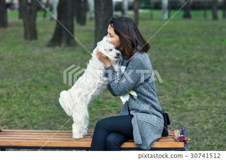 Owner hugging and kiss her dog Owner hugging and kiss her dog 30741512