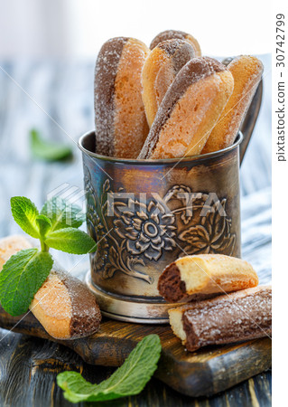 Biscuits in the old metal cup. 30742799