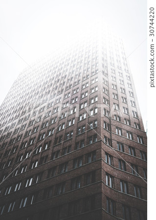 high rise building facade in misty fog high rise building facade in misty fog 30744220