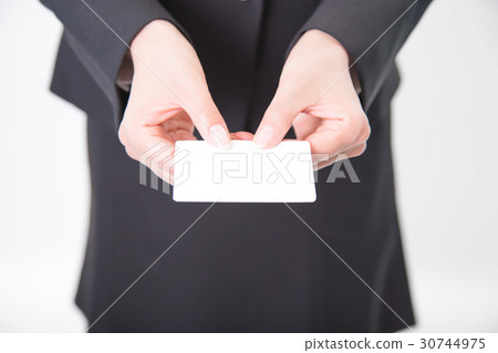 A woman holding a business card 30744975