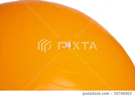 Close up of an orange fitness ball isolated Close up of an orange fitness ball isolated 30746003