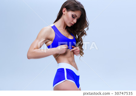 Beautiful fitness girl in a blue sport underwear Beautiful fitness girl in a blue sport underwear 30747535