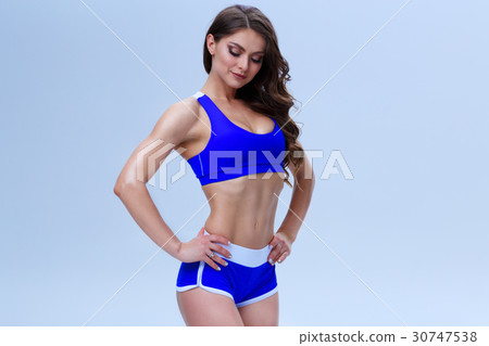 Beautiful fitness girl in a blue sport underwear Beautiful fitness girl in a blue sport underwear 30747538
