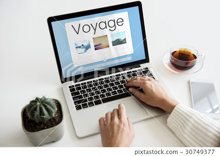Hands working on laptop network graphic overlay 30749377