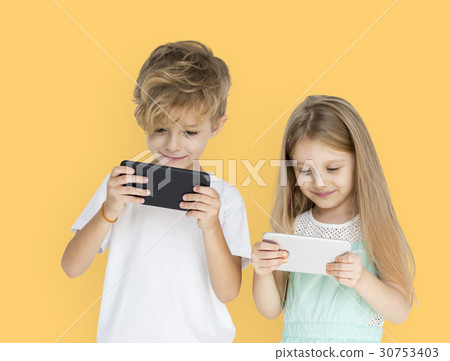 Young Kids Playing Mobile Phone Young Kids Playing Mobile Phone 30753403