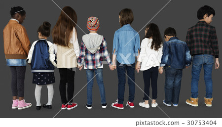 Group of diverse kids students standing in a row holdings hands Group of diverse kids students standing in a row holdings hands 30753404