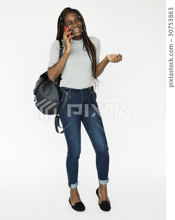 Young adult girl smiling and talking on the phone 30753863