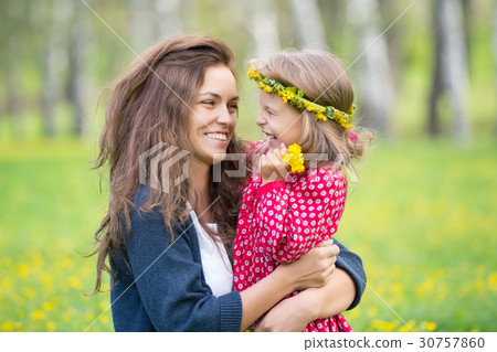 Mother and little daughter in spring park Mother and little daughter in spring park 30757860