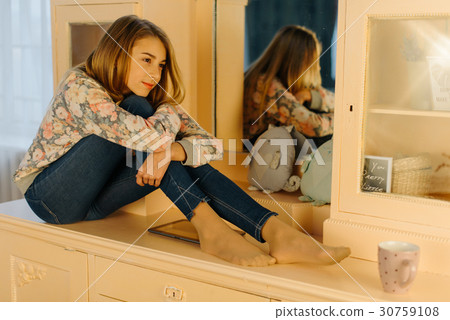 The close-up view of the smiling teenage girl The close-up view of the smiling teenage girl 30759108