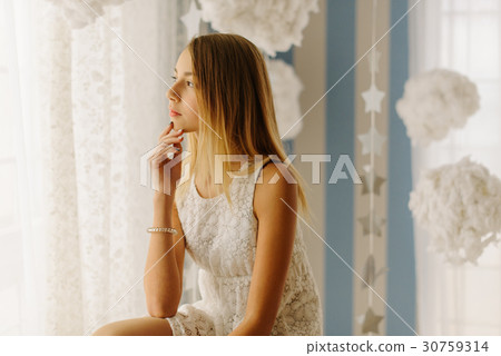 The side portrait of the young teenage girl The side portrait of the young teenage girl 30759314
