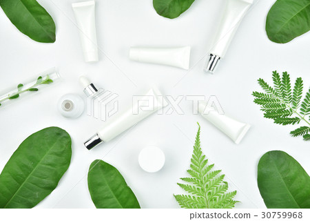 Cosmetic bottle containers with herbal leaves. Cosmetic bottle containers with herbal leaves. 30759968