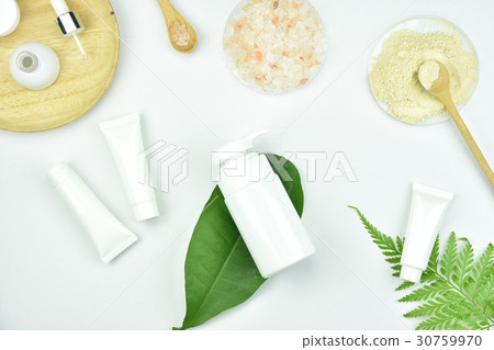 Cosmetic bottle containers with herbal leaves. Cosmetic bottle containers with herbal leaves. 30759970