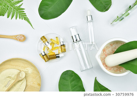 Cosmetic bottle containers with herbal leaves. 30759976