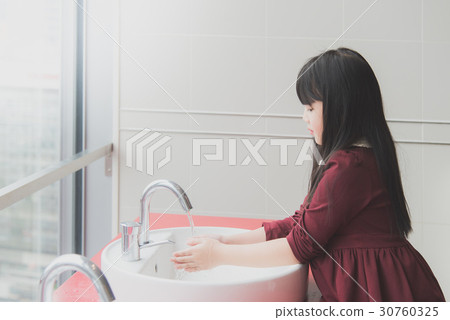 Asian girl washing hands Asian girl washing hands 30760325