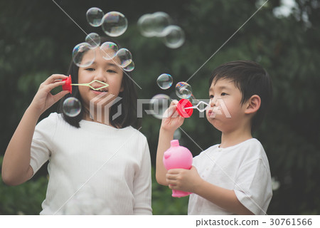 asian children is blowing a soap asian children is blowing a soap 30761566